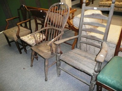 Lot 712 - An Hepplewhite-style elm elbow chair, a Windsor chair, a ladder-back chair and a dining chair