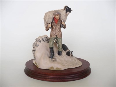 Lot 1035 - Border Fine Arts Shepherd Carrying Ewe 'Winter Rescue', model No. JH41 by Anne Butler, 20.3cm...