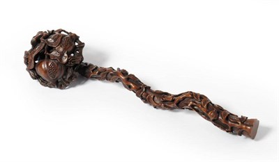 Lot 93 - A Chinese Hardwood Ruyi Sceptre, Qing Dynasty, carved and pierced with fruiting pomegranates,...