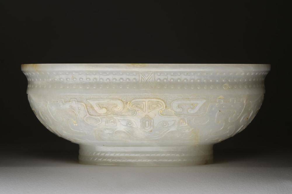 Lot 96 - A Chinese Pale Celadon Jade Bowl, Fanggu mark and period of Qianlong, of oval form carved with...
