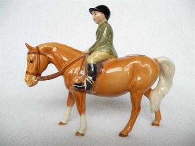 Lot 1089 - Beswick Boy on Palomino Pony (boy looking ahead), model No. 1500, gloss, 14cm high (boy's leg...