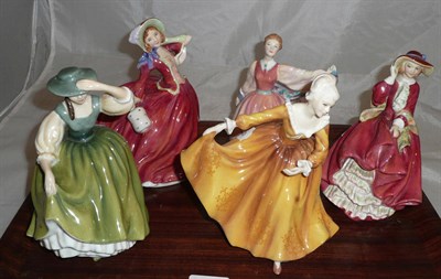 Lot 22 - Five Doulton figures - Kirsty, Autumn Breezes, Buttercup, Top 'o the Hill and Gay Morning