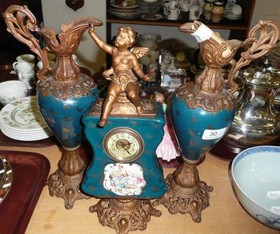 Lot 30 - Gilt spelter and pottery clock garniture, printed with classical figures Please advise value before