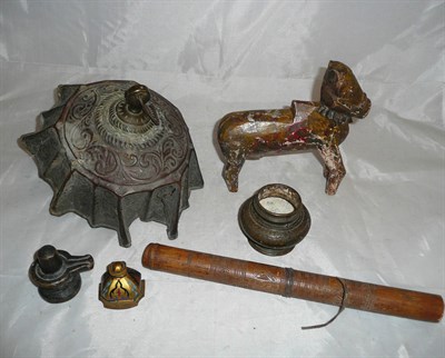 Lot 36 - An antique oil lamp, a painted wooden horse, a small Chinese bronze vase etc