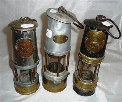 Lot 37 - Three miners safety lamps