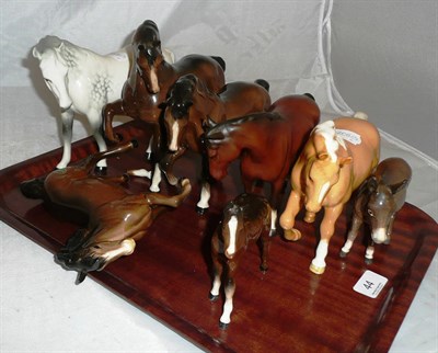 Lot 44 - Beswick grey mare, palomino mare, foal and donkey and four brown horses