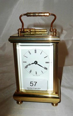 Lot 57 - A modern brass carriage clock and key by Thomas Braithwaite, London