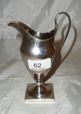 Lot 62 - A George III silver helmet shape cream jug, London 1795