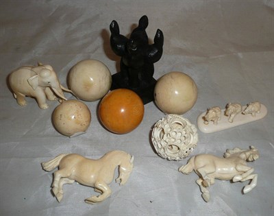 Lot 64 - Five pieces of pre-1940 ivory carvings and four billiard balls