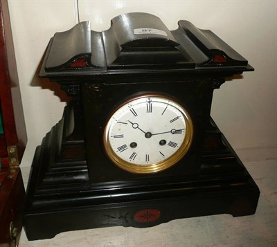 Lot 87 - A black slate striking mantel clock