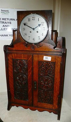 Lot 88 - A smoker's cabinet and an Art Deco clock