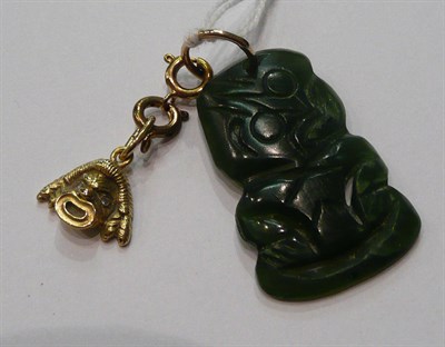 Lot 109 - A New Zealand jade pendant Teke in gold mount