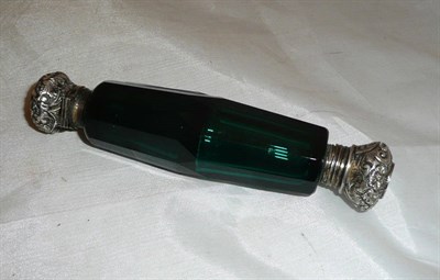 Lot 110 - A green facetted glass, double ended scent bottle with white metal mounts