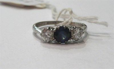 Lot 116 - A diamond and sapphire three stone ring