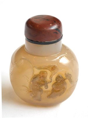 Lot 111 - A Chinese Agate Snuff Bottle and Stopper, of flattened ovoid form, carved with two figures...