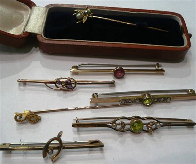 Lot 128 - A fly jewel set stick pin (in case), five bar brooches and another stick pin