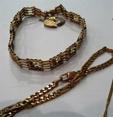 Lot 129 - A 9ct gold Figaro link bracelet and a gate bracelet and a fine chain