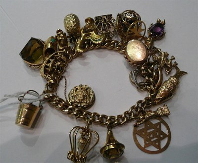 Lot 137 - A 9ct gold charm bracelet