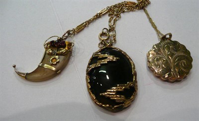 Lot 140 - A 9ct gold stone set pendant on chain, a locket on chain and a claw pendant on chain