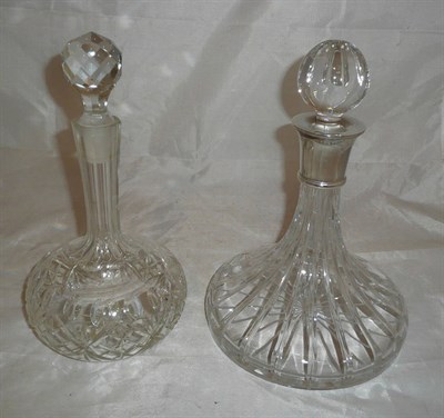 Lot 169 - A silver mounted decanter and another glass decanter