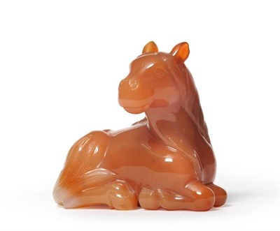 Lot 116 - A Chinese Carved Agate Figure of a Horse, 20th century, naturalistically modelled recumbent,...
