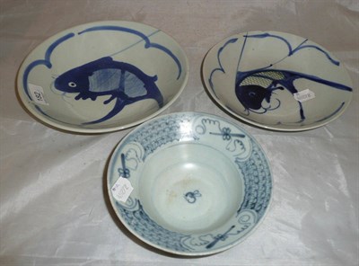 Lot 182 - A Chinese Tek Sing bowl and two Chinese blue and white dishes decorated with fish