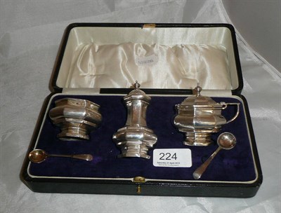 Lot 224 - A cased silver three piece cruet