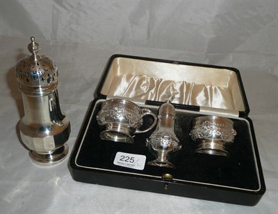 Lot 225 - A three piece silver cruet, cased and a sugar caster