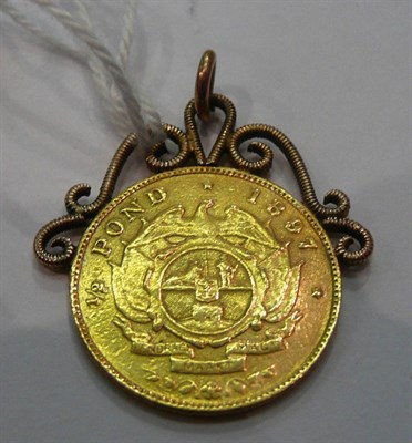 Lot 244 - A 1/2 pond coin on a soldered pendant mount