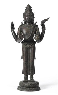 Lot 124 - A Bronze Figure of Siva Mahadeva, possibly Javanese, 9th-11th century, the four-armed deity...