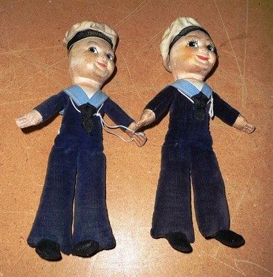 Lot 255 - Two 1930s Norah Welling type sailor boy dolls with original caps each bearing ship's name