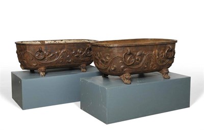 Lot 125 - Two Chinese Cast Iron Cisterns, of rounded rectangular form with ring handles, cast with...