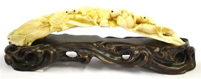 Lot 126 - A Japanese Tusk Okimono, 20th century, probably warthog tusk, modelled as turtles on a...