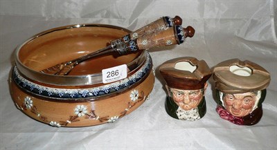 Lot 286 - Royal Doulton stoneware salad bowl and servers with plated mounts, two Royal Doulton character...