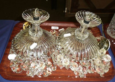 Lot 291 - A pair of moulded glass and cut glass ceiling shades (2)