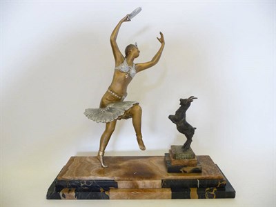 Lot 301 - An Art Deco spelter group, modelled as a slave dancer wearing a fringed skirt, bodice and headdress