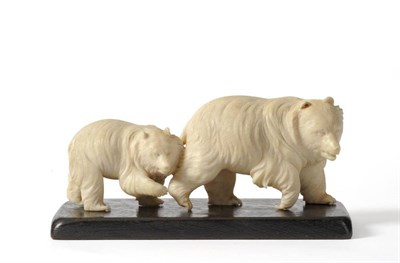 Lot 130 - A Japanese Ivory Okimono, Meiji period, as a bear and cub walking in single file, 15cm long, with a