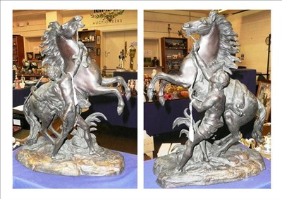 Lot 320 - A pair of bronze marly horses, each signed Coustou, height