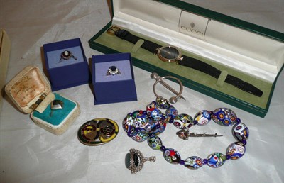 Lot 351 - A wristwatch, by Gucci, on leather strap, assorted silver rings, costume jewellery, brooches...