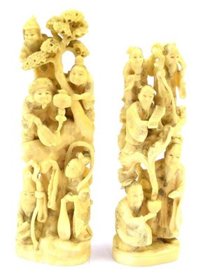 Lot 136 - A Japanese Marine Ivory Okimono, Meiji period, as figures emanating from a magician's bowl held...