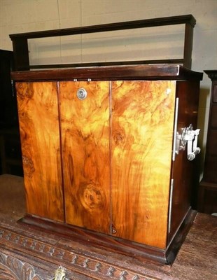 Lot 381 - A walnut cigar cabinet