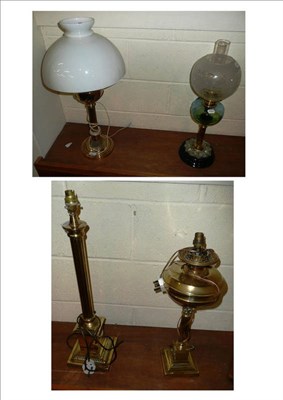 Lot 382 - Four various oil and glass lamps