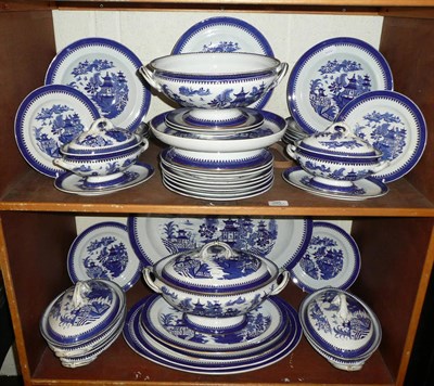 Lot 395 - A 19th century Worcester Willow pattern dinner service comprising a large meat plate with gravy...