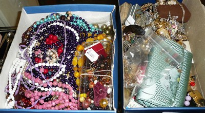 Lot 413 - Two boxes of costume jewellery, including bead necklaces, a Sphinx brooch, other brooches,...