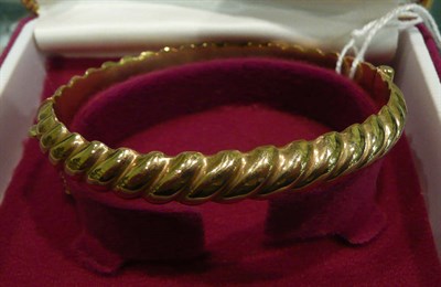 Lot 431 - A 9carat gold hollow bangle