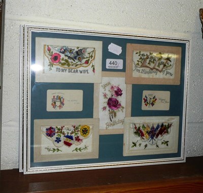 Lot 440 - Nine embroidered silk postcards displayed in two glazed frames