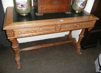 Lot 481 - Carved oak writing table