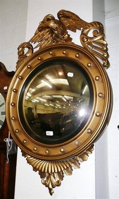 Lot 491 - A gilt Regency style convex wall mirror