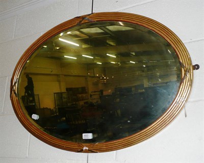 Lot 493 - A gilt framed oval wall mirror