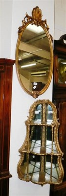 Lot 498 - Gilt three tier wall shelves and a small mirror